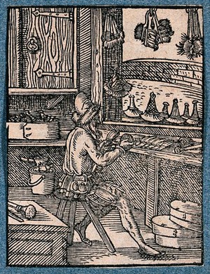 view A man making brushes at his work bench. Woodcut by J. Amman.