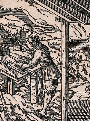 view A brickmaker making bricks and roofing tiles: others carry them away in wheelbarrows to be fired in a kiln. Woodcut by J. Amman.