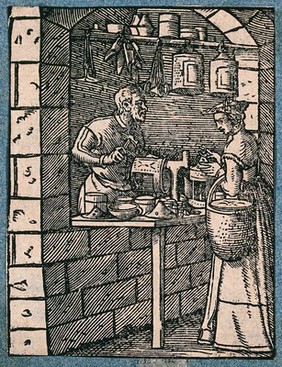 A lantern maker working at his bench, talking to a woman customer who inspects a finished lantern. Woodcut by J. Amman.