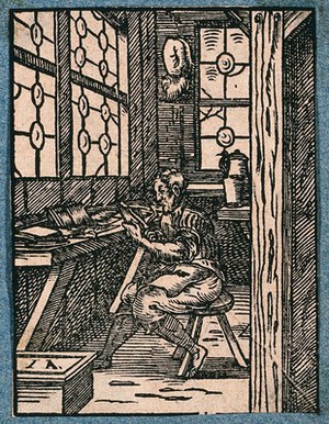 view A craftsman making combs. Woodcut by J. Amman.