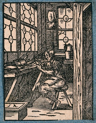 A craftsman making combs. Woodcut by J. Amman.
