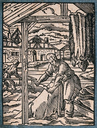 A tanner or leather worker scraping animal hides. Woodcut by J. Amman.