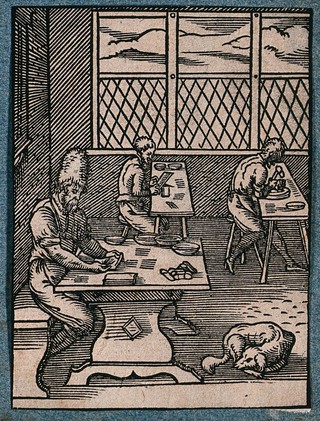 Three craftsmen making clasps. Woodcut by J. Amman.