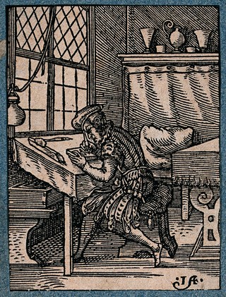 A craftsman making a woodcut. Woodcut by J. Amman.