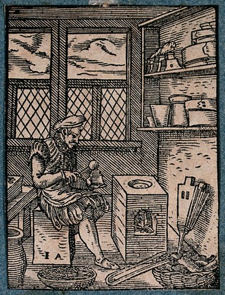 A typefounder making type characters for printers. Woodcut by J. Amman.