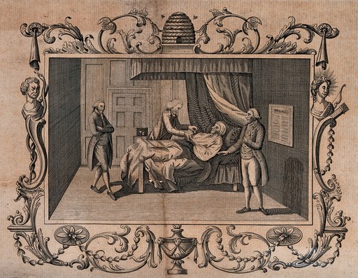 A sick man in a bed, receiving support from members of his