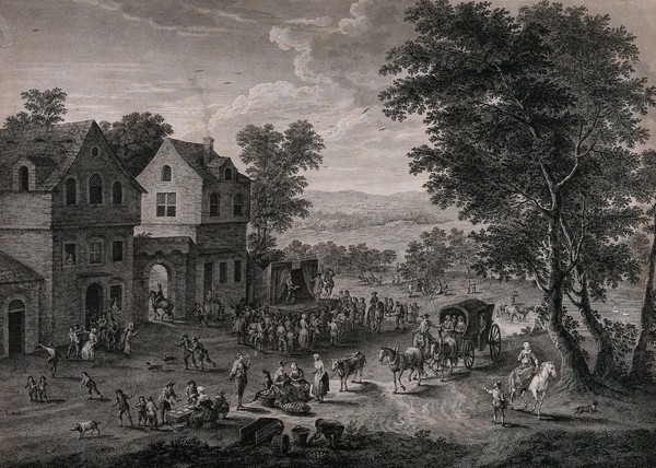 Crowds of people are gathered for a fete, a stage has been set up and actors are performing a play. Engraving by F. Dequevauviller, 1777, after M. Schoevaerdts.