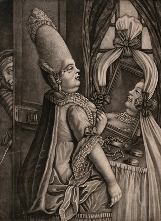 A woman wearing a fine dress with pearls around her neck, a very elaborate hair style and beauty spots, checks her appearance in a mirror before going out to the new fashionable resort of the Pantheon in London. Mezzotint by P. Dawe, 1772.