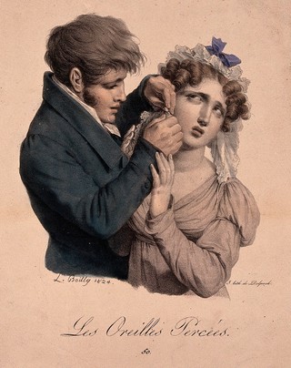 A man is piercing a girl's ear for an earring. Coloured lithograph after L. Boilly, 1824.