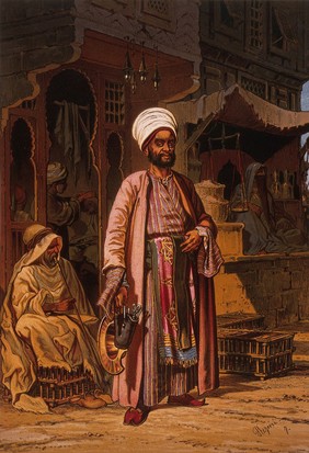 A barber is standing outside his shop in Cairo with the instruments of his trade in his hands. Colour lithograph after Amadeo Preziosi.