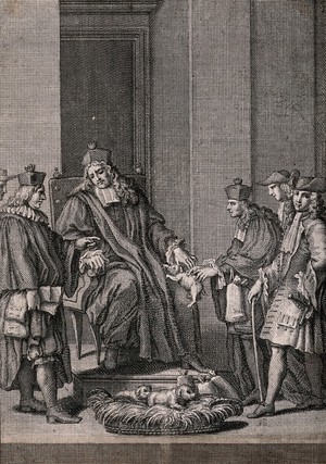 view A man in a clerical cloak and hat is sitting on a chair as a puppy is handed to him from a basket on the floor at his feet. Engraving.