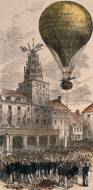 view A large balloon is hanging over the old town hall at Calais preparing for take-off. Coloured wood engraving.