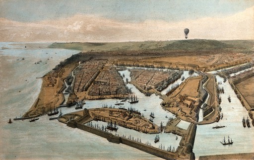A hot-air balloon travels over a landscape giving an aerial view. Coloured lithograph by Jules Arnout after himself.
