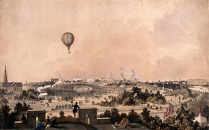 view A balloon flies over a park with marquees and bunting where crowds of people are gathered. Coloured lithograph.