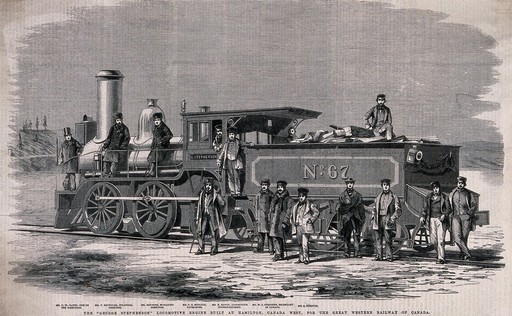 Men are crowded around and sitting on a steam locomotive. Wood engraving.