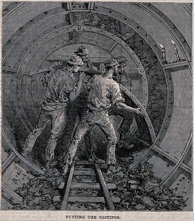 Workmen fitting metal casings to form an underground tunnel. Wood engraving, 1868.