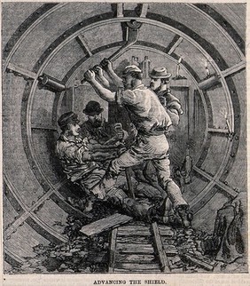 Workmen fitting the metal casings for an underground tunnel. Wood engraving, 1868.