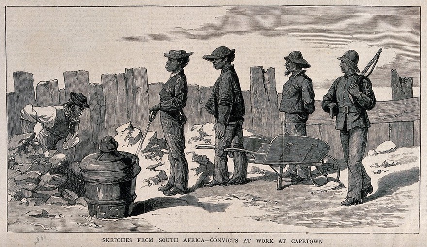 Prisoners in Cape Town with spades and a wheelbarrow are digging a hole in the road: a guard with a rifle stands by. Wood engraving, 1878.