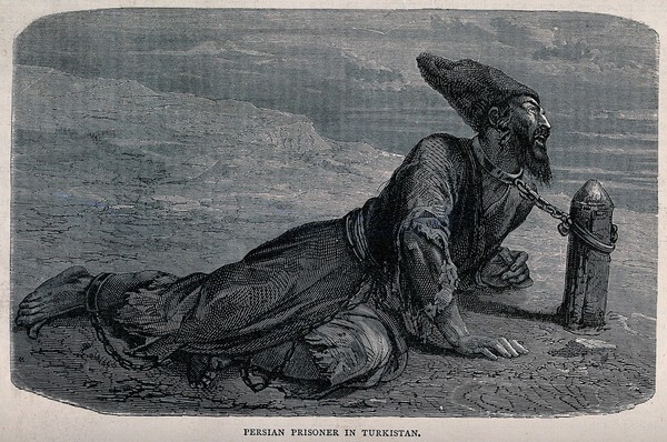 A Persian captive lying on the road chained by his neck to a post embedded in the road. Wood engraving.