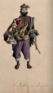 A barefoot man wearing a cloak, hat and beads: he is carrying a stick. Watercolour.