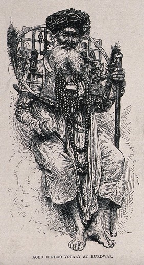 An old Hindu ascetic, or holy man, at Haridwar: seated, with a circular grating around his neck. Wood engraving, ca. 1870.