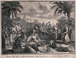view A burial suttee: a widow has been placed in a grave beside her dead husband. Engraving after B. Picart, 1729.