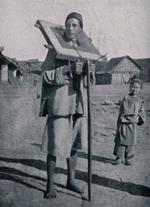 view A Chinese man carrying the cangue around his neck as a punishment. Halftone, 19--.