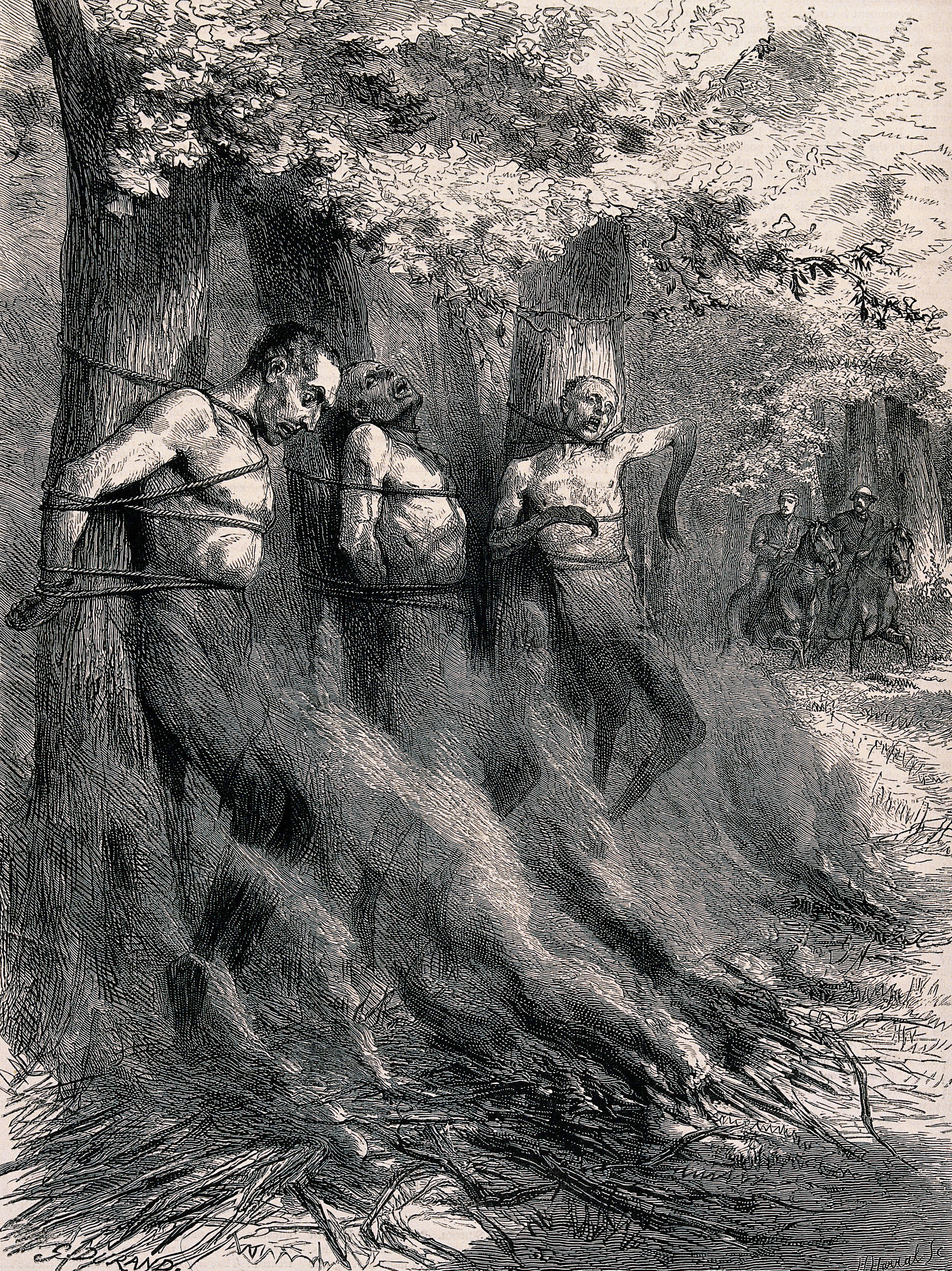 Three naked men are tied to trees with a bonfire set alight before them threatening to burn or asphyxiate them. Wood engraving by Horace Harral after Godefroy Durand.
