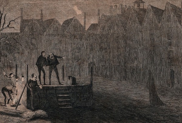 Workmen prepare the scaffold for an execution at night with one workman pointing at a ghostly figure dressed in black rushing past the block. Etching by G. Cruikshank.