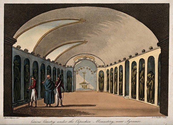 Gentlemen visiting the vaults in the Capuchin tombs of Palermo. Coloured aquatint by J.C. Stadler after Cooper Willyams.