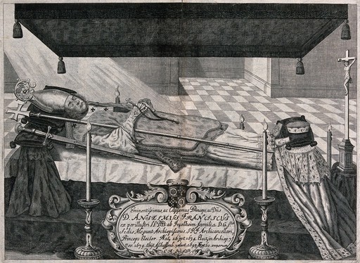 Anselmus Franciscus (1635-1695), archiepiscopal of Aschaffenburg, on his bier, dressed in his habit and surrounded by his regalia. Line engraving with etching.