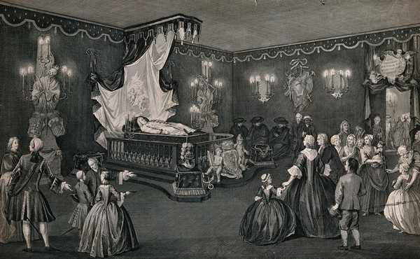 The lying in state of Willem IV, Prince of Orange-Nassau, surrounded by his grieving family and servants. Line engraving with etching by J. Punt after P. De Swart, 1752.