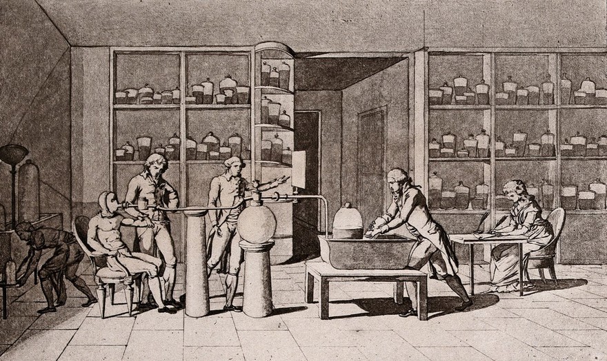 Lavoisier in his laboratory conducting an experiment on the respiration of a man resting. Photogravure after M.A.P. Lavoisier.