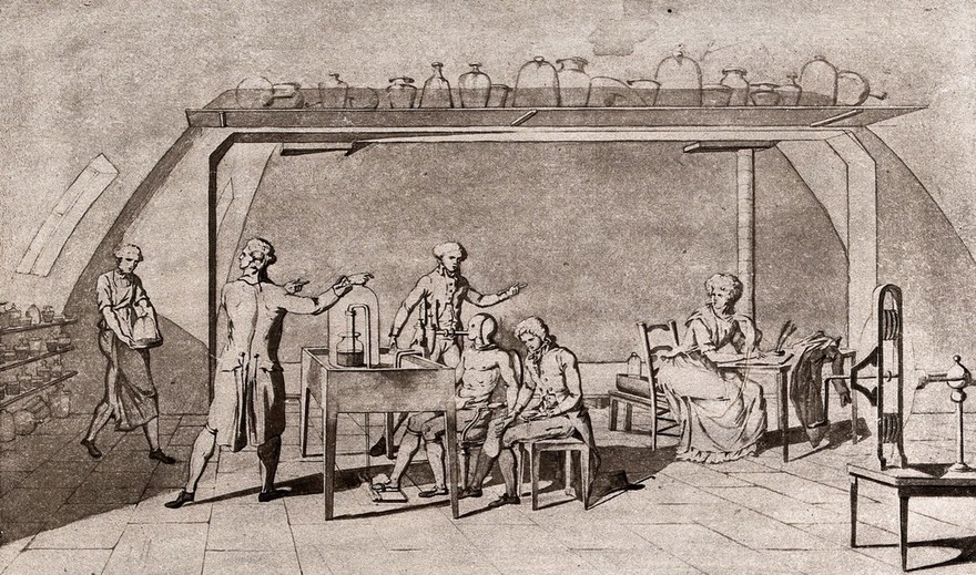 Lavoisier in his laboratory conducting an experiment on the respiration of a man at work. Photogravure after M.A.P. Lavoisier.