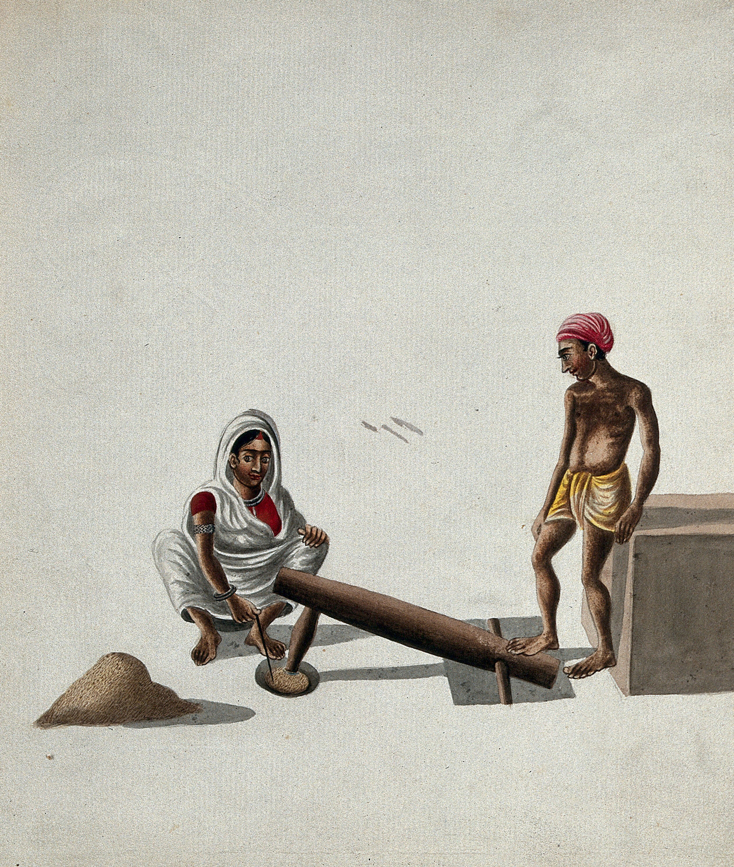 A Man And A Woman Pounding And Mixing Grains Or Spices With A Foot