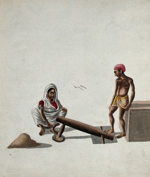 view A man and a woman pounding and mixing grains or spices with a foot-operated mortar and pestle. Gouache painting by an Indian artist.