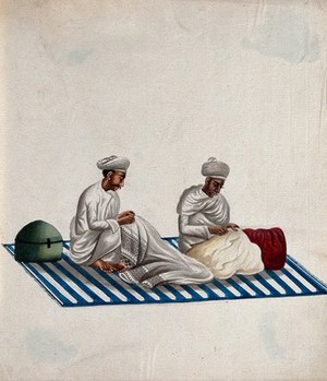 view Two men sitting on a carpet, engaged in needle work. Gouache painting by an Indian artist.