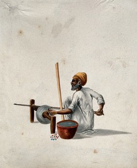 A man polishing semi-precious (?) stones. Gouache painting by an Indian artist.