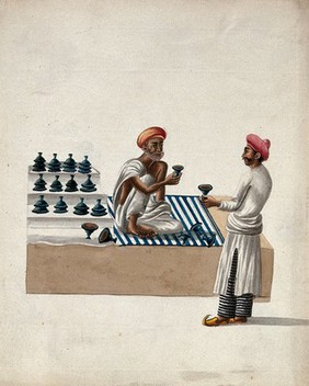 A shopkeeper selling earthen diyas (lamps) (?) to a man. Gouache painting by an Indian artist.