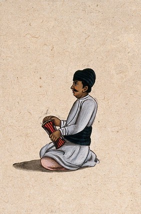 A musician holding an Indian percussion instrument. Gouache painting by an Indian artist.