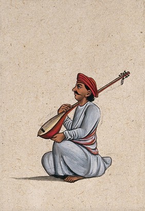 An Indian musician playing a sitar (stringed instrument). Gouache painting by an Indian artist.