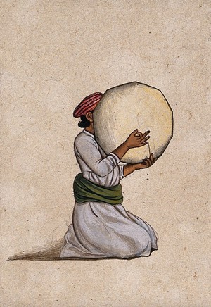 view An Indian musician playing a tambourine without jingles. Gouache painting by an Indian artist.