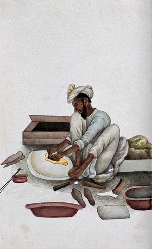 view A shoemaker making slippers. Watercolour by an Indian painter.