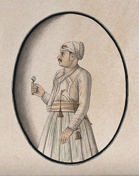 A Mughal courtier holding a flower. Watercolour drawing by an Indian artist.
