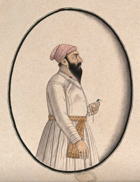 A Mughal courtier wearing a pink turban and holding an ornament (?). Watercolour drawing by an Indian artist.