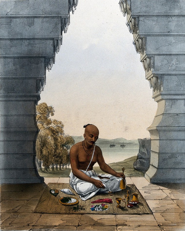 A Brahmin praying to Vishnu pouring water on the saligram