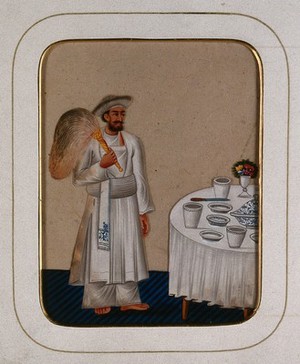 view A servant standing next to a dining table, holding a fly whisk. Gouache painting on mica by an Indian artist.