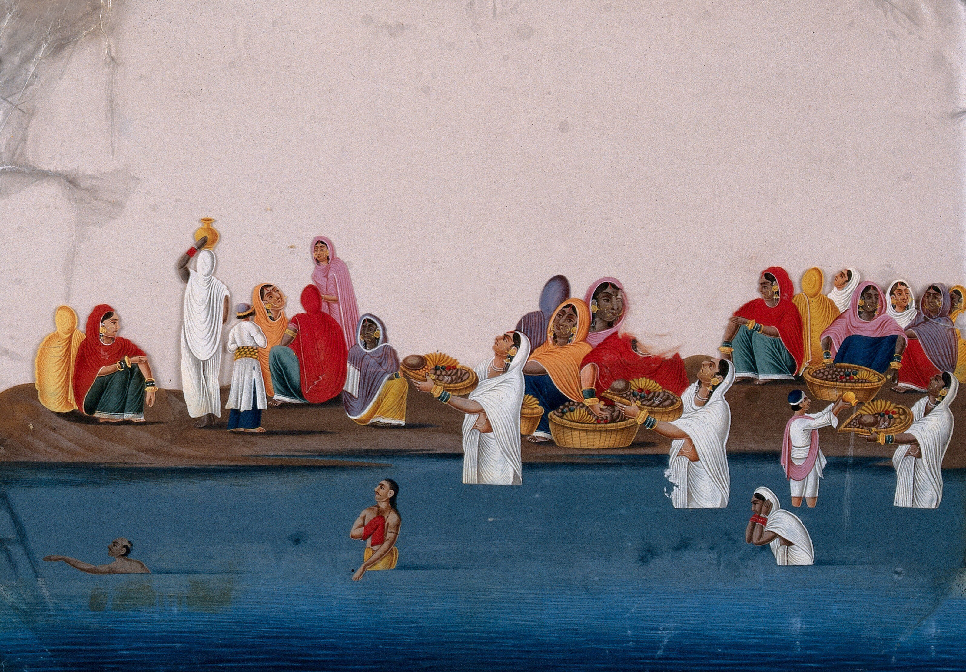 People Bathing And Praying In The Ganges While A Group Of Women