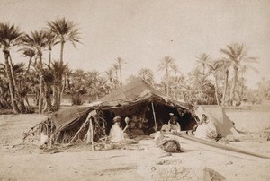 view A tent with a Bedouin family in Northern Africa. Photograph.