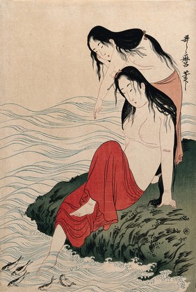 Two amas (women divers) on shore watching fish in the water. Colour woodcut after Utamaro, 1900/1920 (?).